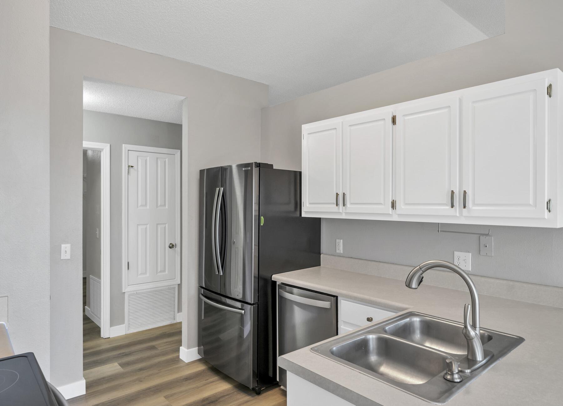5130 Whitehurst Lane Crestview, FL 32536 - Photo 18 of 49 a kitchen with stainless steel appliances granite countertop a refrigerator sink and cabinets
