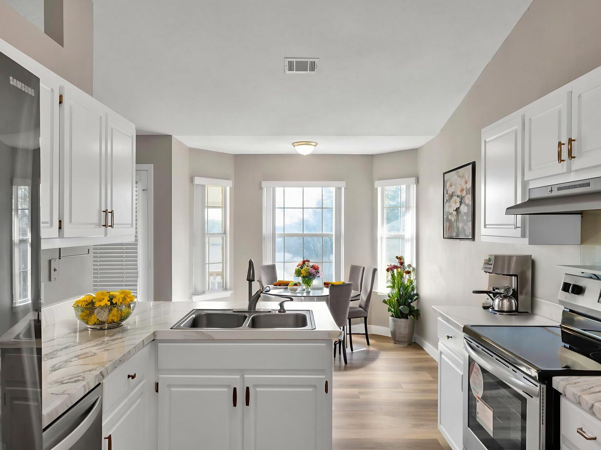 5130 Whitehurst Lane Crestview, FL 32536 - Photo 19 of 49 a kitchen with a sink stove and wooden cabinets