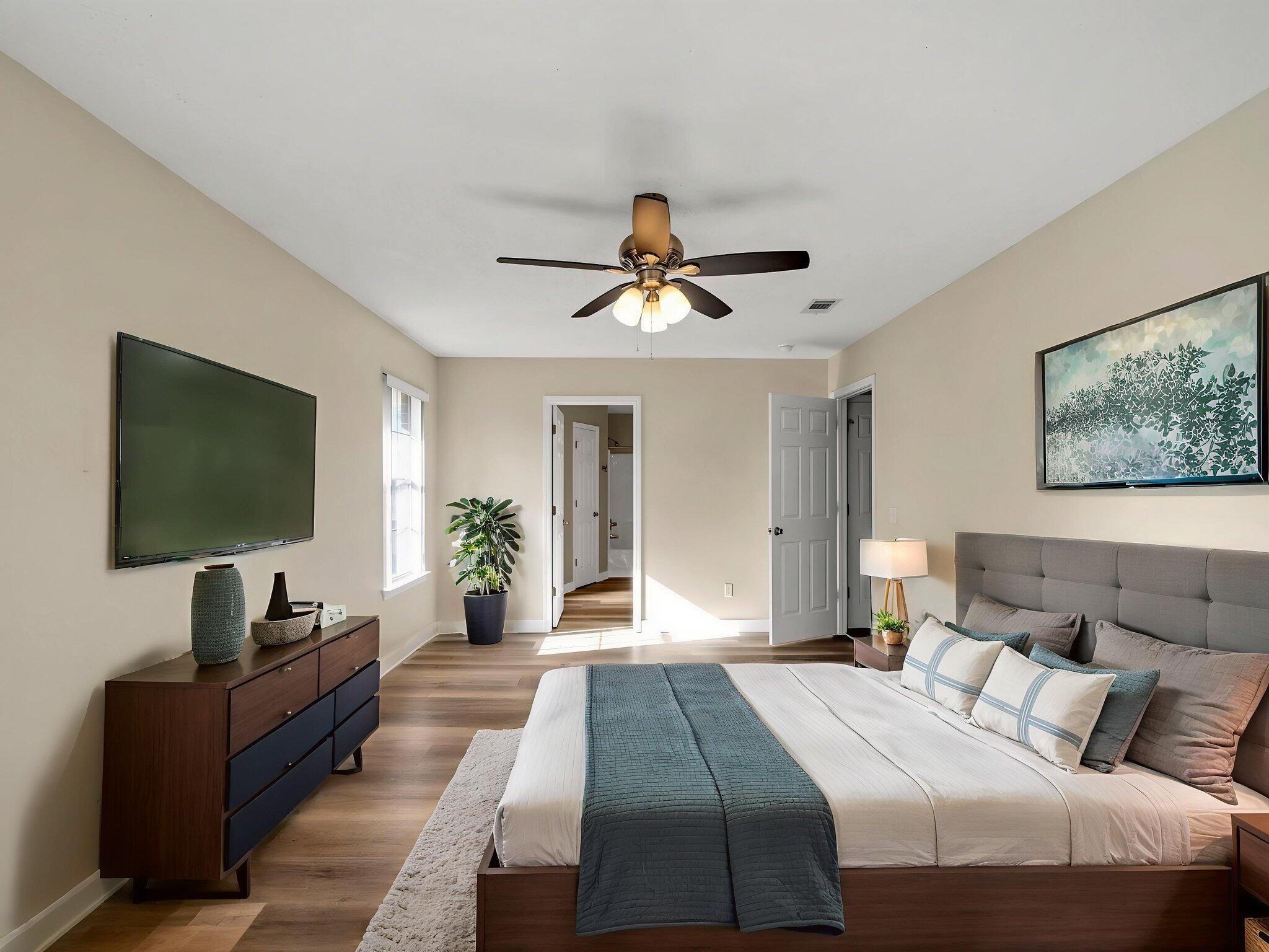 5130 Whitehurst Lane Crestview, FL 32536 - Photo 22 of 49 a bedroom with a bed and a flat screen tv