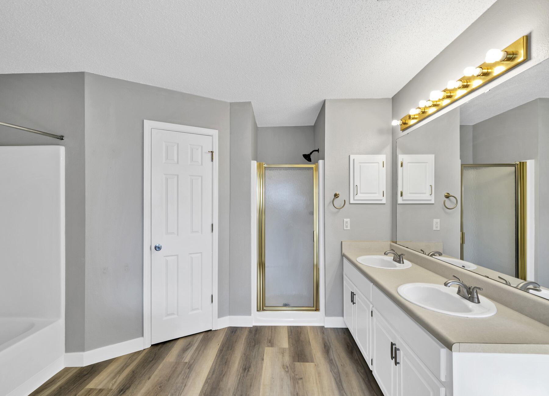 5130 Whitehurst Lane Crestview, FL 32536 - Photo 25 of 49 a bathroom with a double vanity sink and mirror