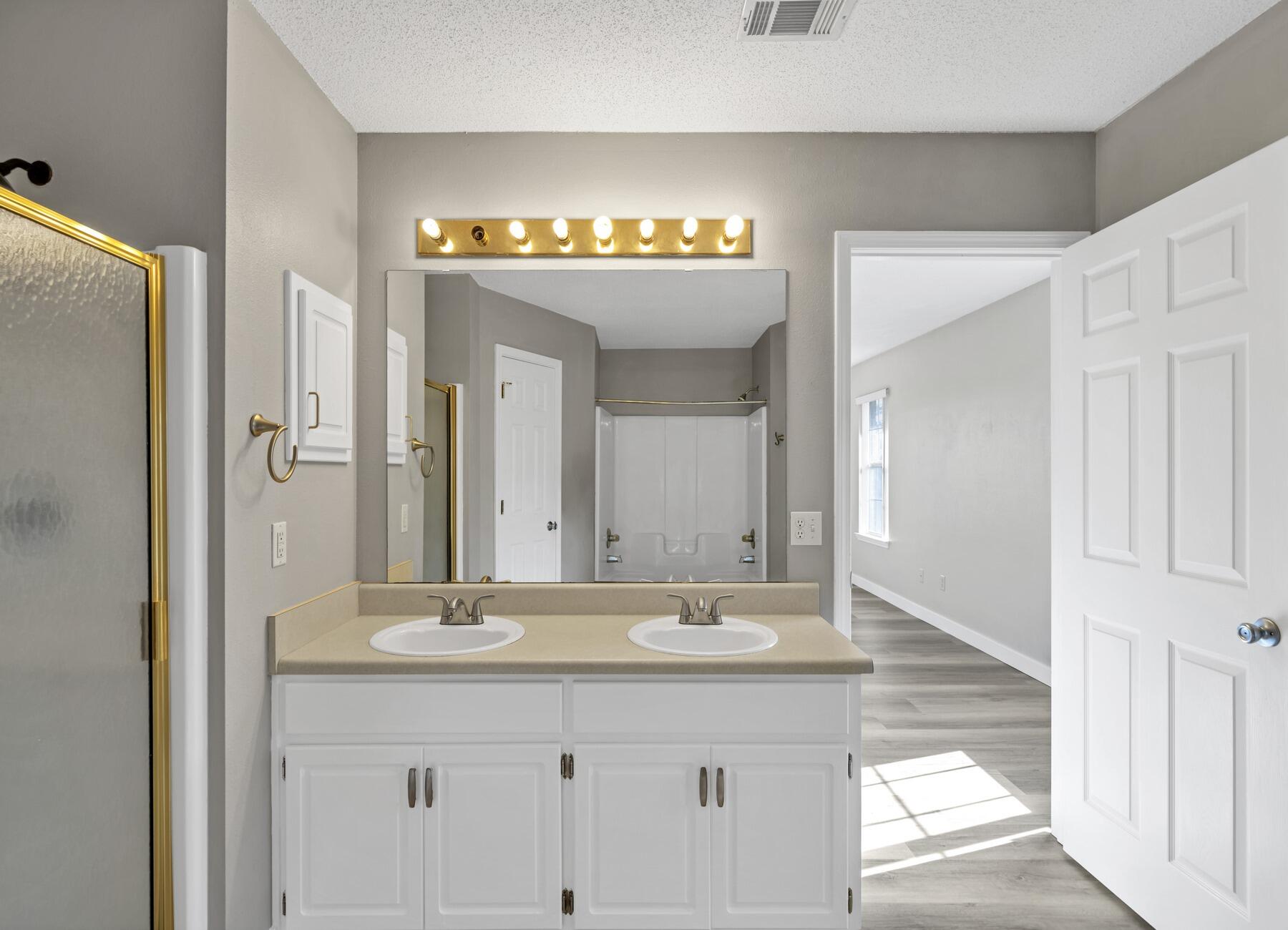 5130 Whitehurst Lane Crestview, FL 32536 - Photo 26 of 49 a bathroom with a sink and a mirror