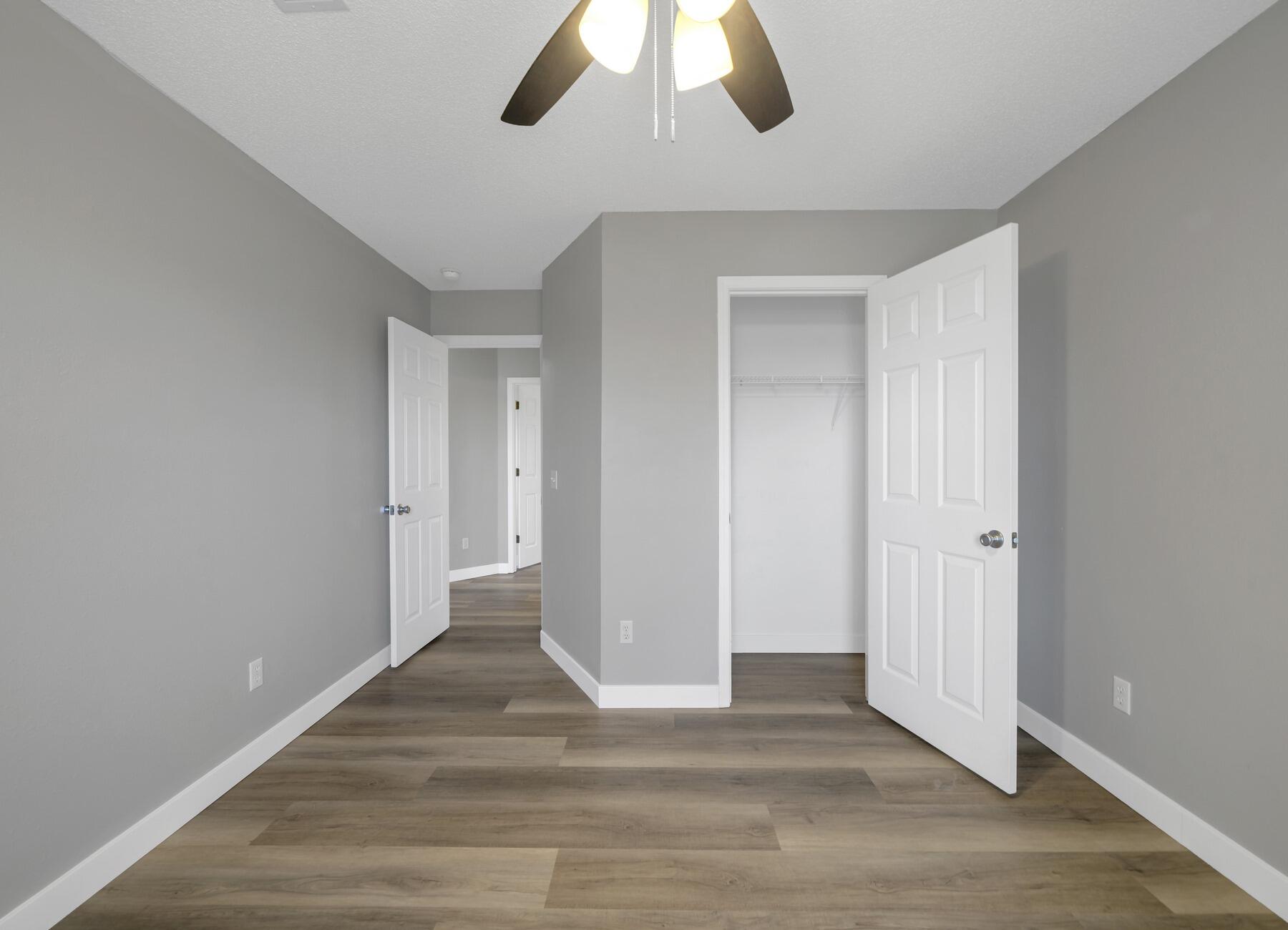 5130 Whitehurst Lane Crestview, FL 32536 - Photo 31 of 49 a view of an empty room with wooden floor