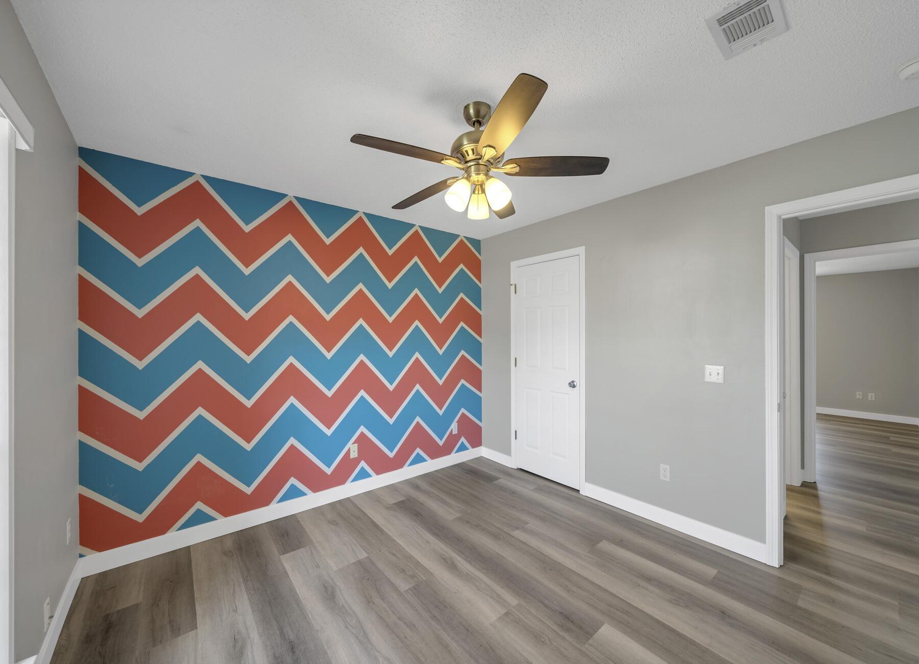 5130 Whitehurst Lane Crestview, FL 32536 - Photo 36 of 49 a room that has a rug and a ceiling fan