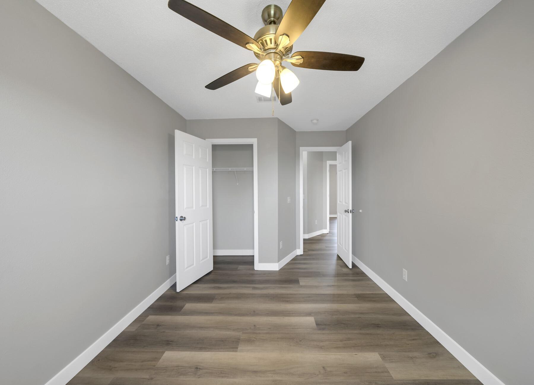 5130 Whitehurst Lane Crestview, FL 32536 - Photo 38 of 49 a view of an empty room with wooden floor