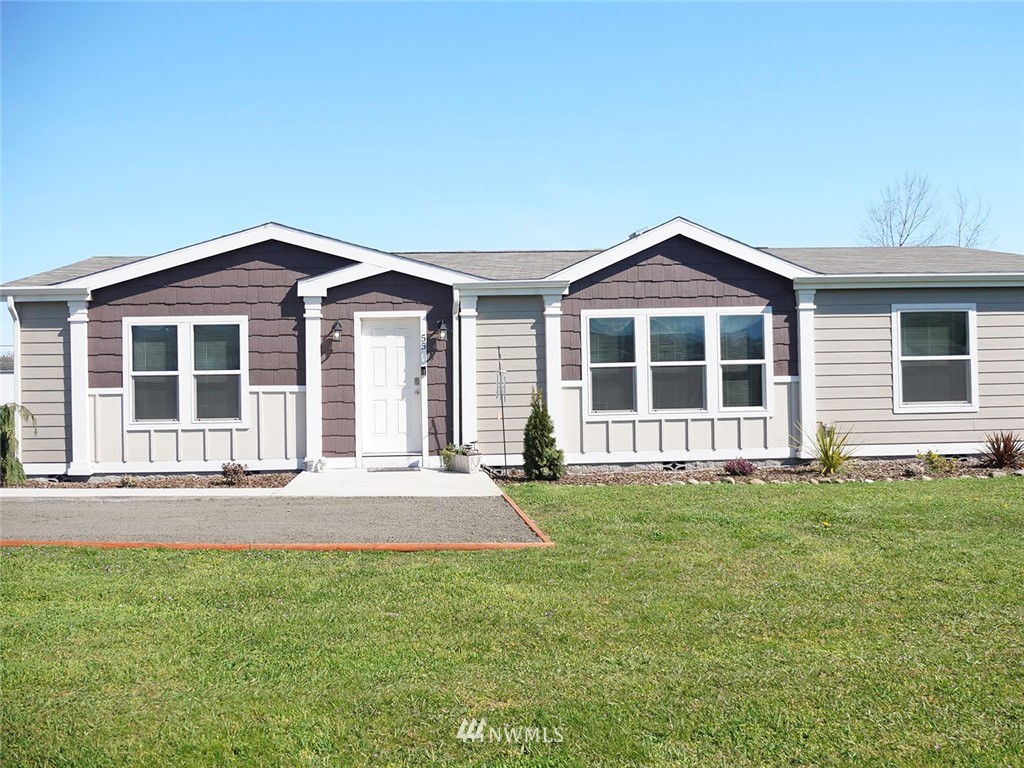 55 Old Goat Lane Sequim, WA 98382 - Photo 1 of 32 a front view of a house with a garden
