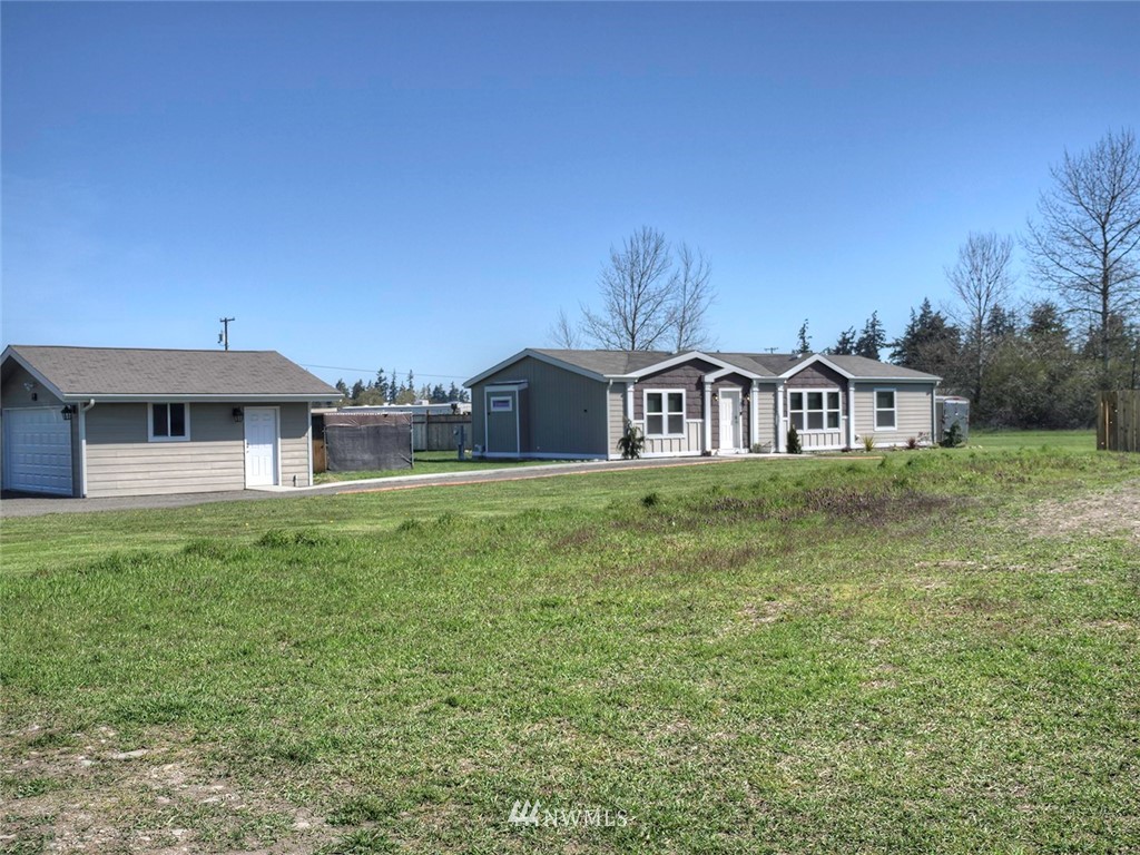 55 Old Goat Lane Sequim, WA 98382 - Photo 2 of 32 a front view of a house with garden