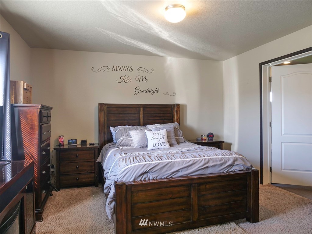 55 Old Goat Lane Sequim, WA 98382 - Photo 11 of 32 a bedroom with a bed and a television