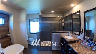 55 Old Goat Lane Sequim, WA 98382 - Photo 12 of 32 a bathroom with a sink a toilet a mirror and vanity