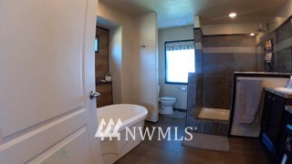 55 Old Goat Lane Sequim, WA 98382 - Photo 13 of 32 a bathroom with a sink and mirror