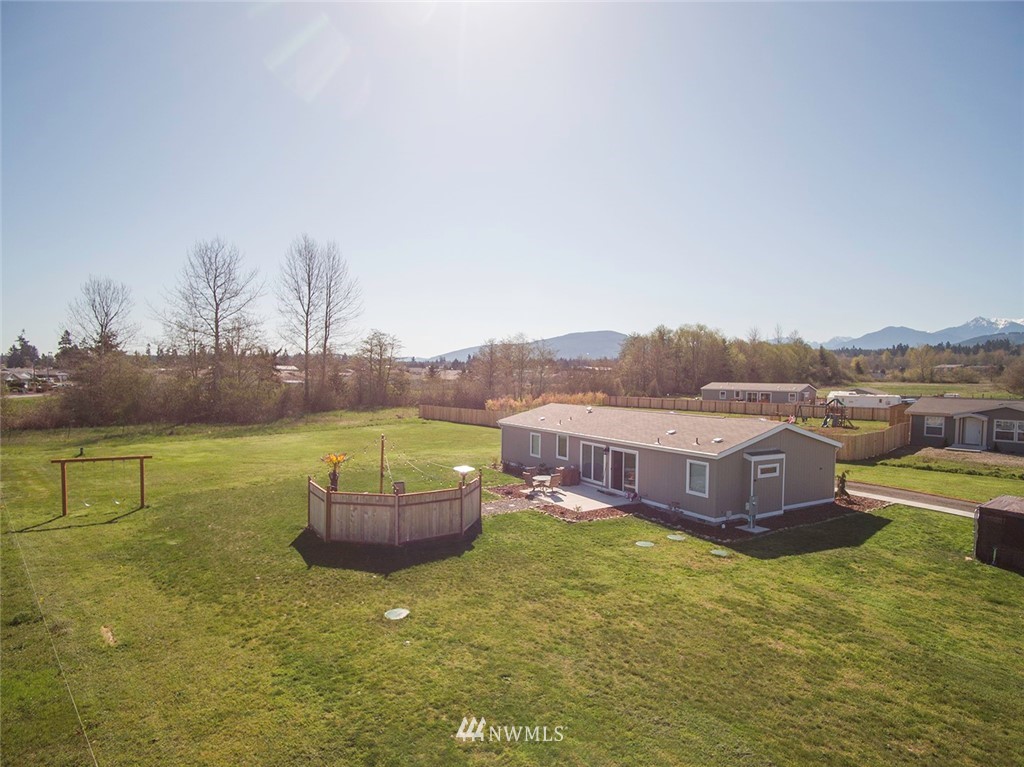 55 Old Goat Lane Sequim, WA 98382 - Photo 21 of 32 a swimming pool with outdoor seating and yard