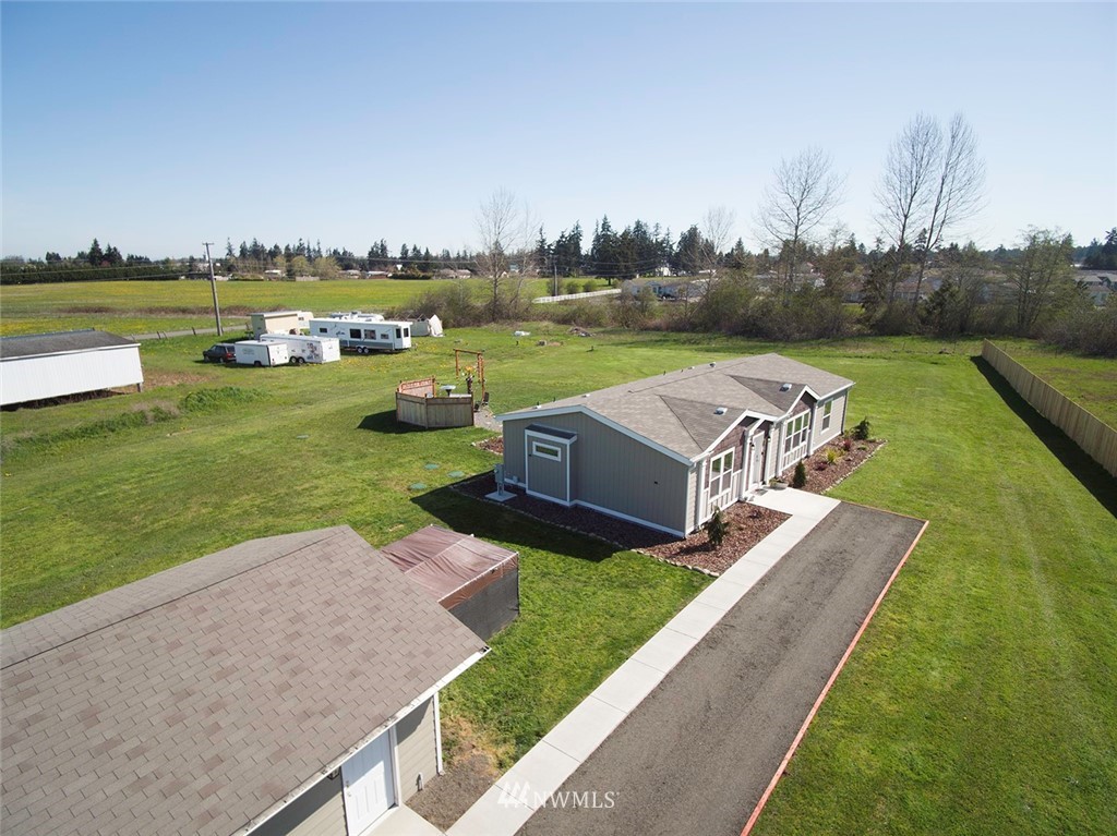 55 Old Goat Lane Sequim, WA 98382 - Photo 28 of 32 an aerial view of a house with garden space and lake view