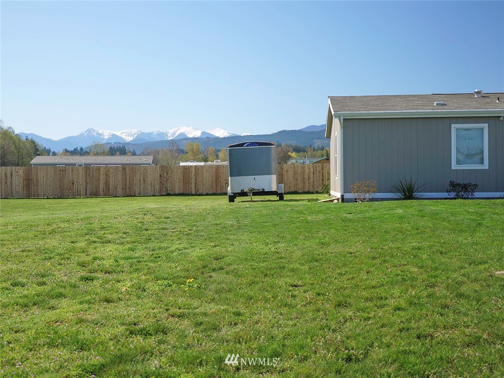 55 Old Goat Lane Sequim, WA 98382 - Photo 31 of 32 a view of a backyard with a garden