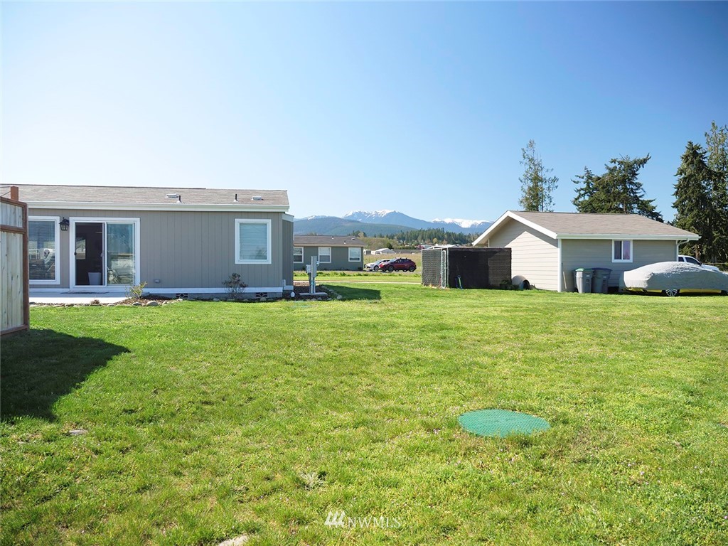 55 Old Goat Lane Sequim, WA 98382 - Photo 32 of 32 a swimming pool with outdoor seating and yard