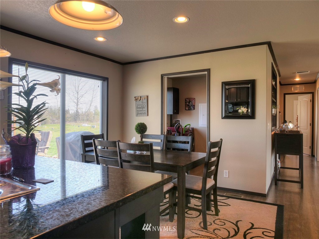 55 Old Goat Lane Sequim, WA 98382 - Photo 8 of 32 a view of a dining room with furniture window and wooden floor