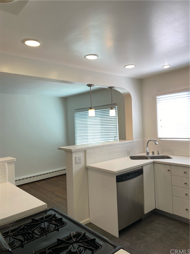 11767 Sunset Boulevard, Unit 202 Los Angeles, CA 90049 - Photo 14 of 23 a kitchen that has a sink and a stove in it