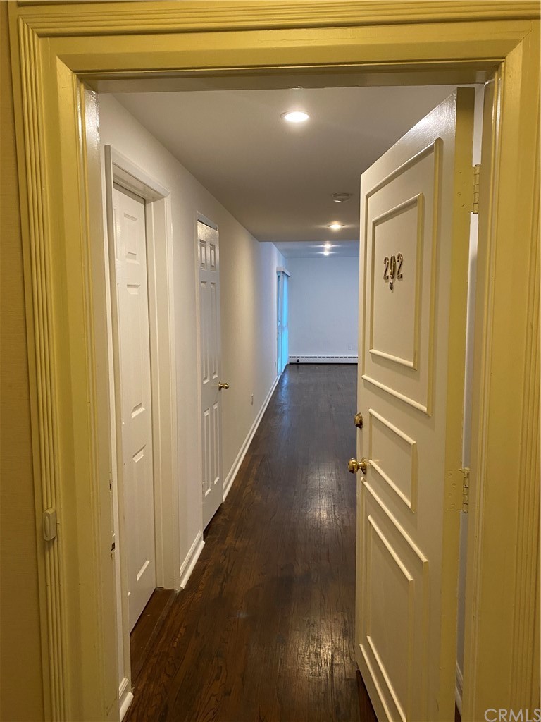 11767 Sunset Boulevard, Unit 202 Los Angeles, CA 90049 - Photo 5 of 23 a view of a hallway with wooden floor