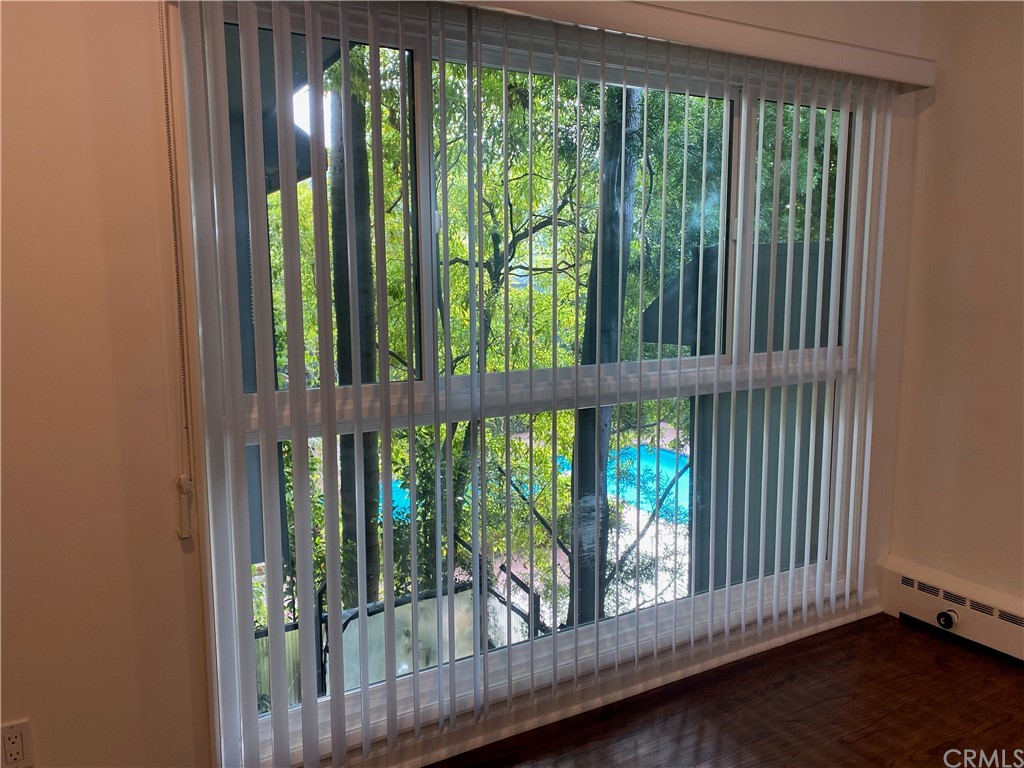 11767 Sunset Boulevard, Unit 202 Los Angeles, CA 90049 - Photo 8 of 23 a view of a large window with an outdoor space