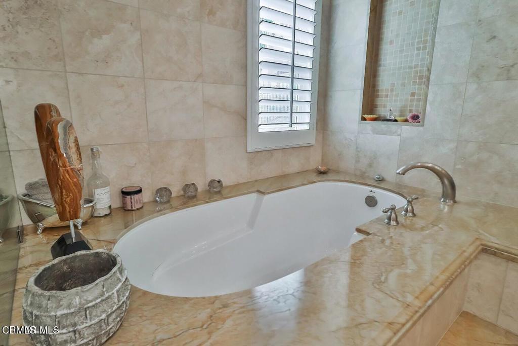 963 Corte Augusta Camarillo, CA 93010 - Photo 15 of 27 a bathroom with a tub and a sink