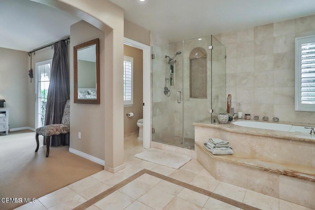 963 Corte Augusta Camarillo, CA 93010 - Photo 22 of 27 a spacious bathroom with a tub shower and sink