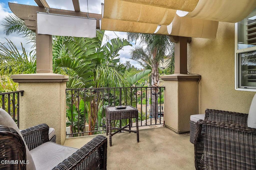 963 Corte Augusta Camarillo, CA 93010 - Photo 23 of 27 a balcony with table and chairs