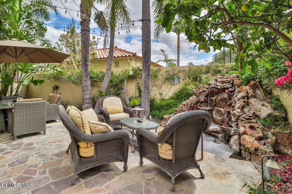 963 Corte Augusta Camarillo, CA 93010 - Photo 27 of 27 a view of a patio with a table and chairs under an umbrella