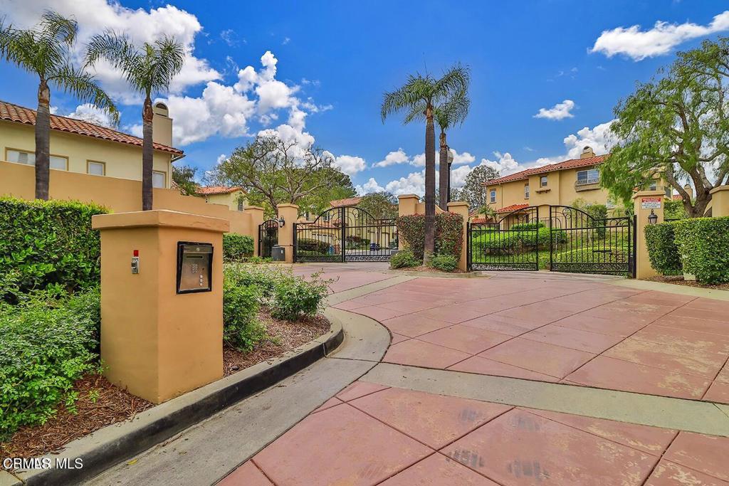 963 Corte Augusta Camarillo, CA 93010 - Photo 4 of 27 a view of a house with a yard and potted plants