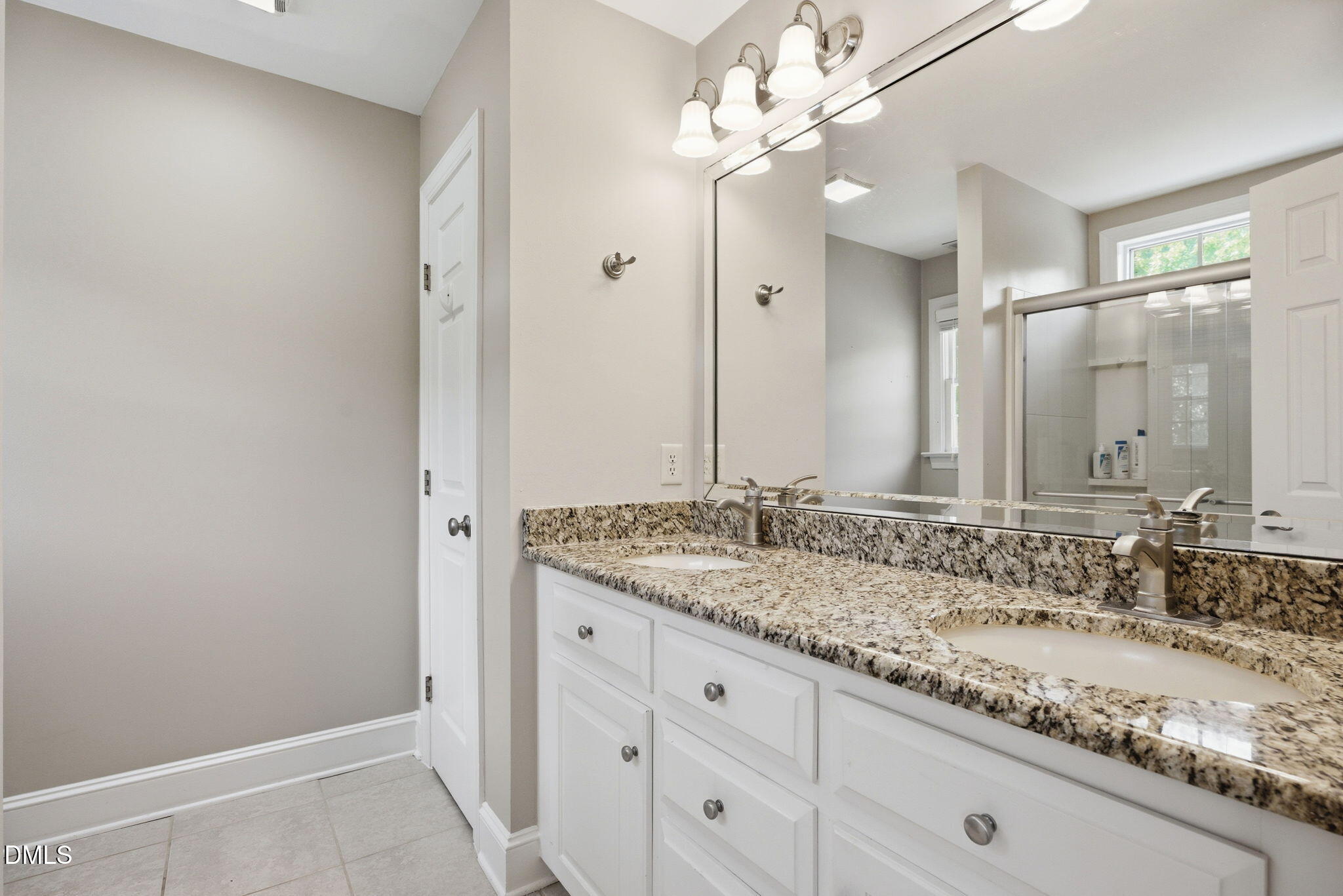 5416 Pulley Town Road Zebulon, NC 27597 - Photo 27 of 74 a bathroom with a granite countertop sink and a mirror
