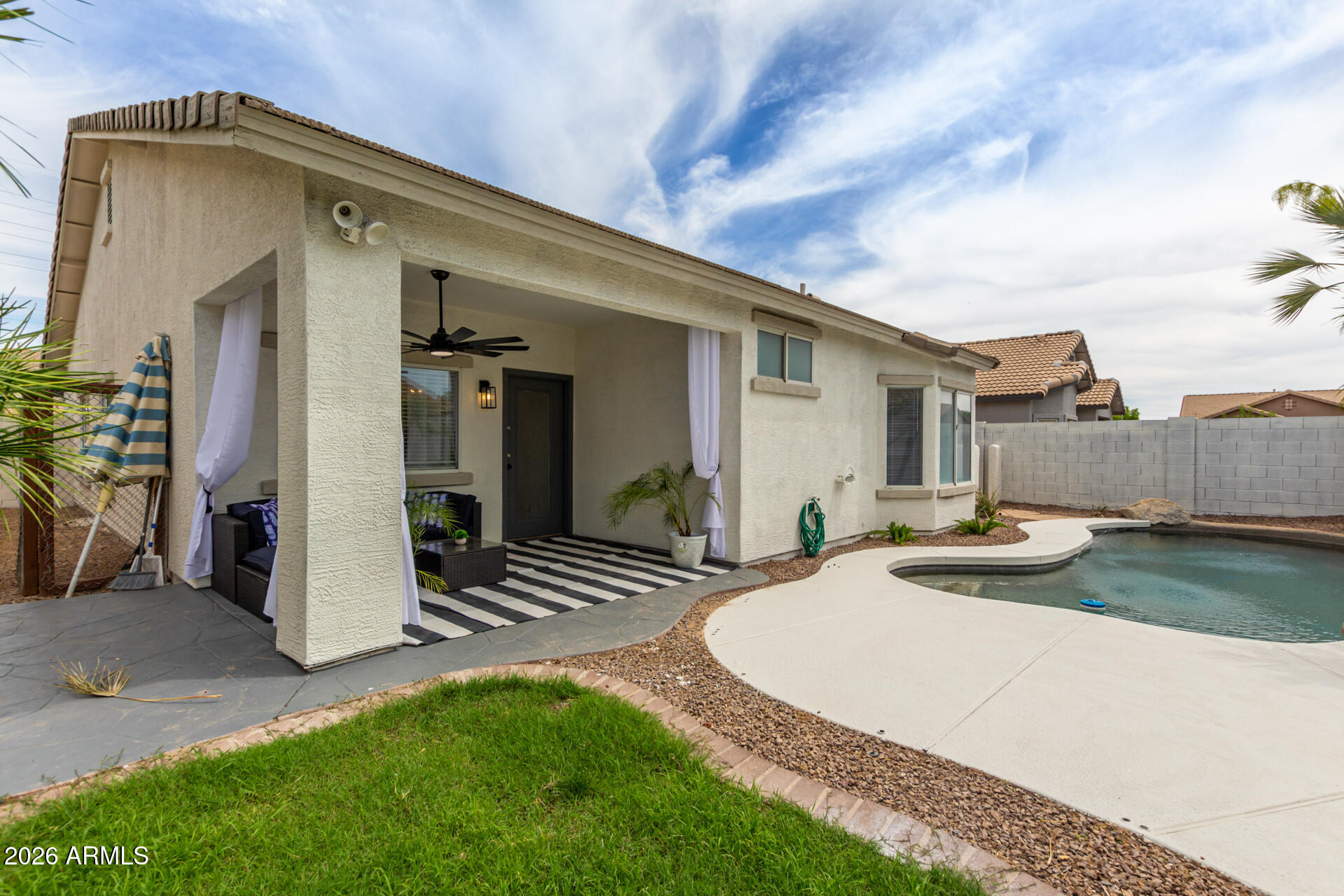 3674 South Joshua Tree Lane Gilbert, AZ 85297 - Photo 25 of 30 a view of a house with backyard and porch