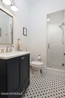 a room with gym equipment and a flat screen tv