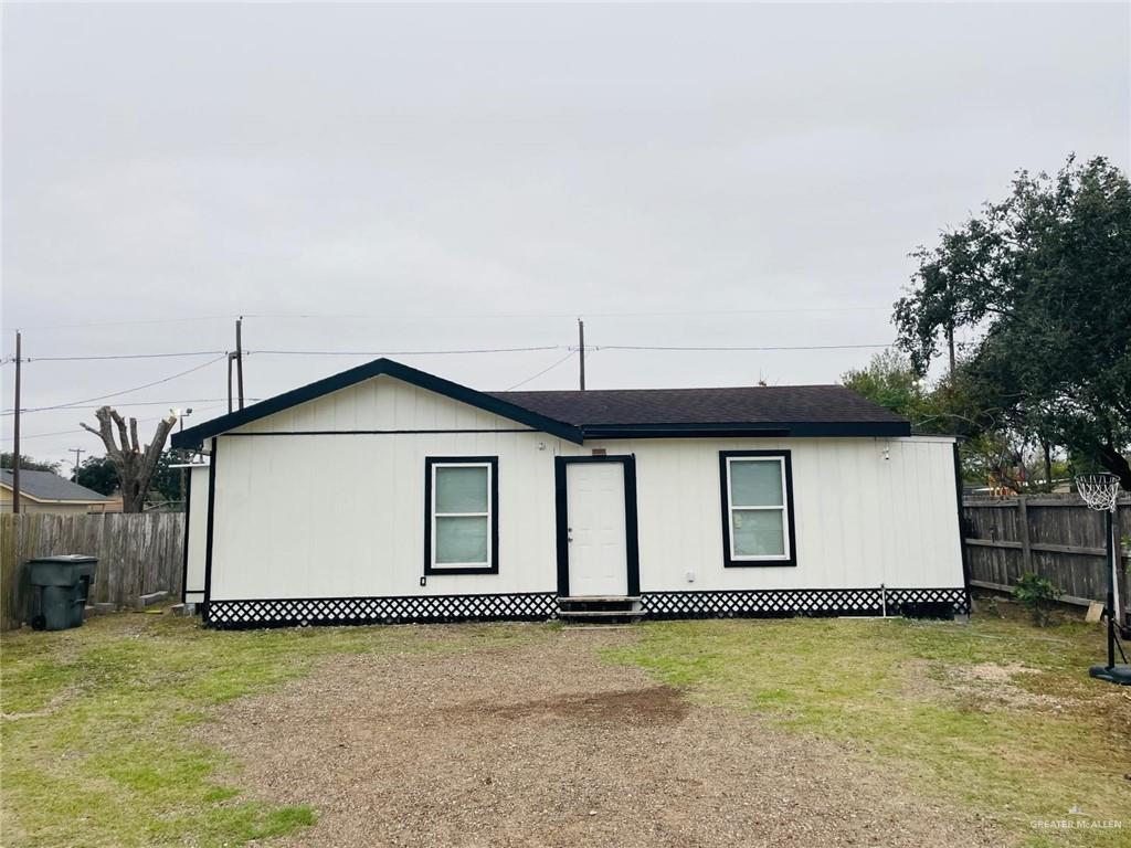 206 Commercial Street Edcouch, TX 78538 - Photo 2 of 16 a front view of a house with a yard and garage