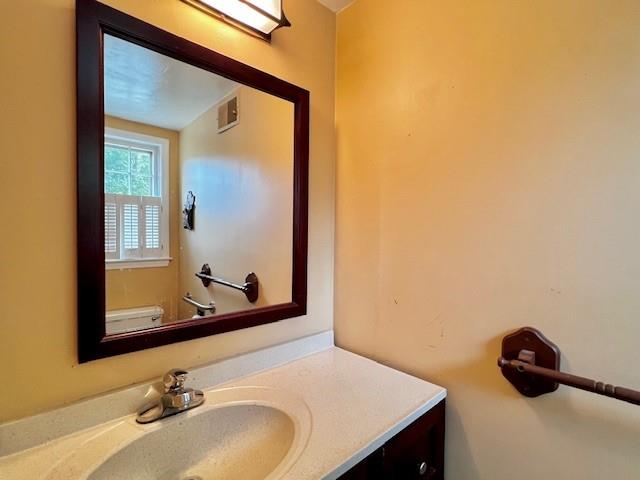 4541 Arcado Road Southwest Lilburn, GA 30047 - Photo 6 of 16 a bathroom with a sink and a mirror
