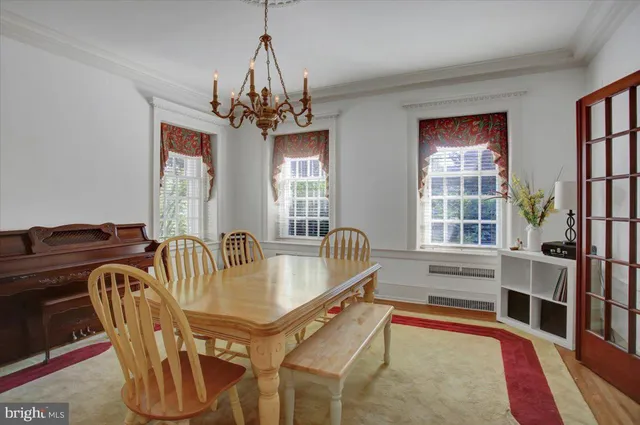 a kitchen with a table and chairs in it