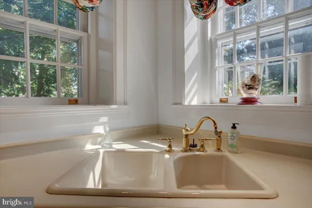 a view of a room with wooden floor and a window