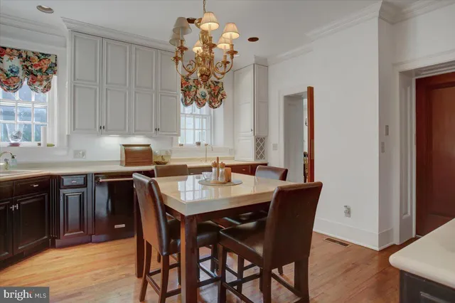 a view of staircase with railing and white walls