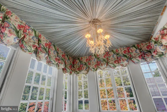 a view of living room with furniture and floor to ceiling window
