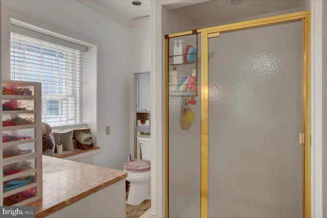 an empty room with a door and wooden floor