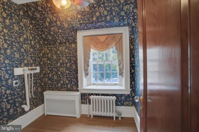 a bathroom with a shower and a sink