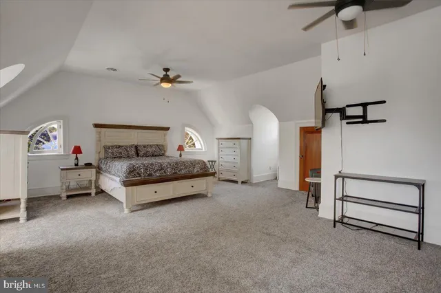 a front view of a house with lots of green space