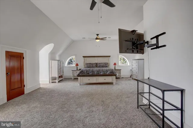 a front view of a house with a yard garage and outdoor seating