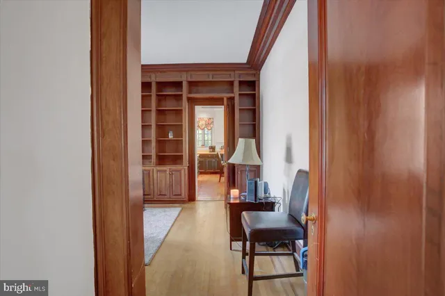 a view of a livingroom with an empty space and a fireplace