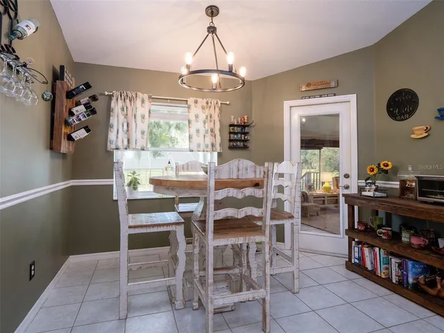 a kitchen with stainless steel appliances granite countertop a sink and a stove top oven with wooden cabinets