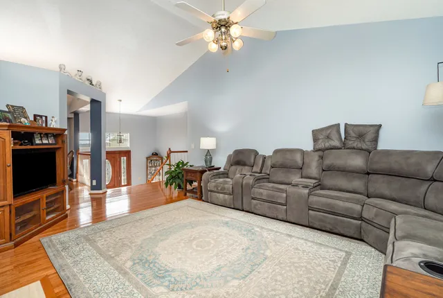 a living room with furniture and a flat screen tv