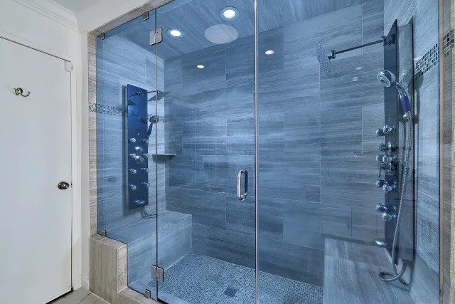 a bathroom with a shower and toilet