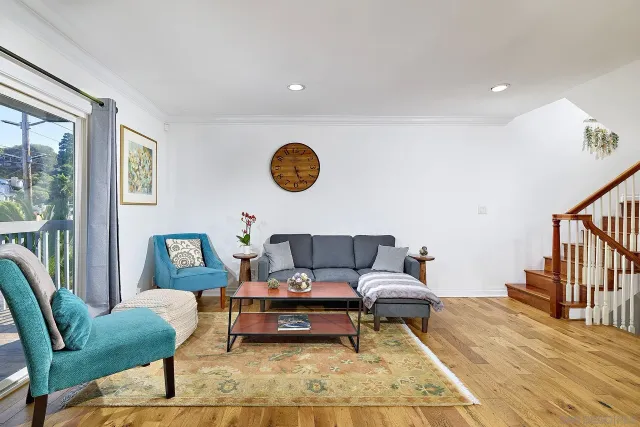 a living room with furniture and a table