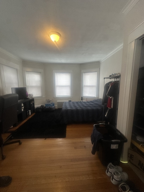 47 Wallingford Road, Unit 1 Boston, MA 02135 - Photo 13 of 16 a living room with furniture and a mirror