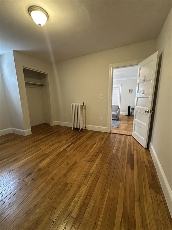 47 Wallingford Road, Unit 1 Boston, MA 02135 - Photo 8 of 16 wooden floor in a hall with an entryway