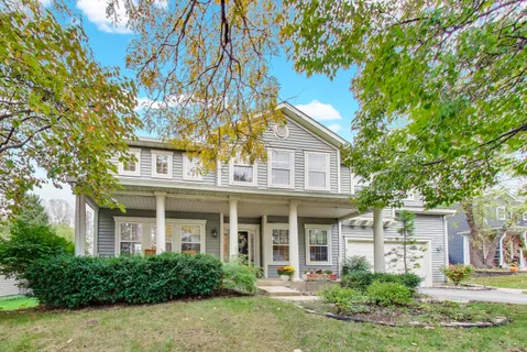front view of a house with a yard