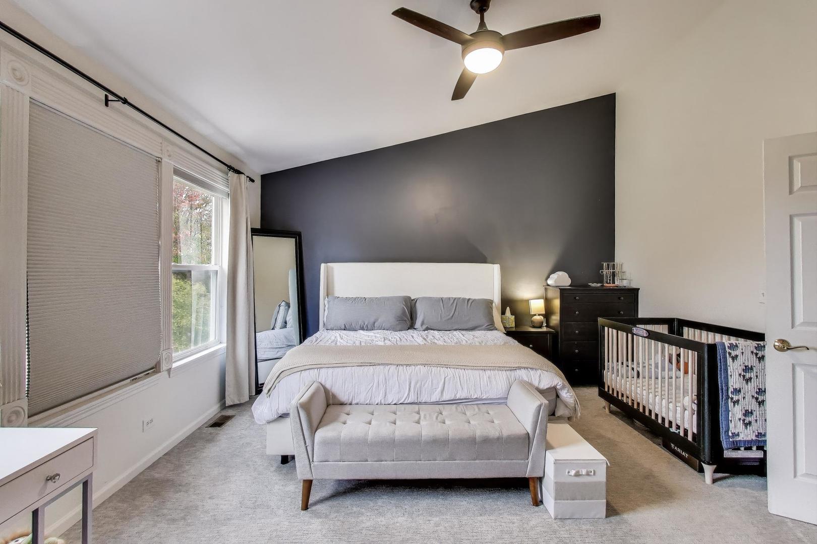 1010 Evergreen Street Mundelein, IL 60060 - Photo 15 of 28 a bedroom with a bed a window and dresser