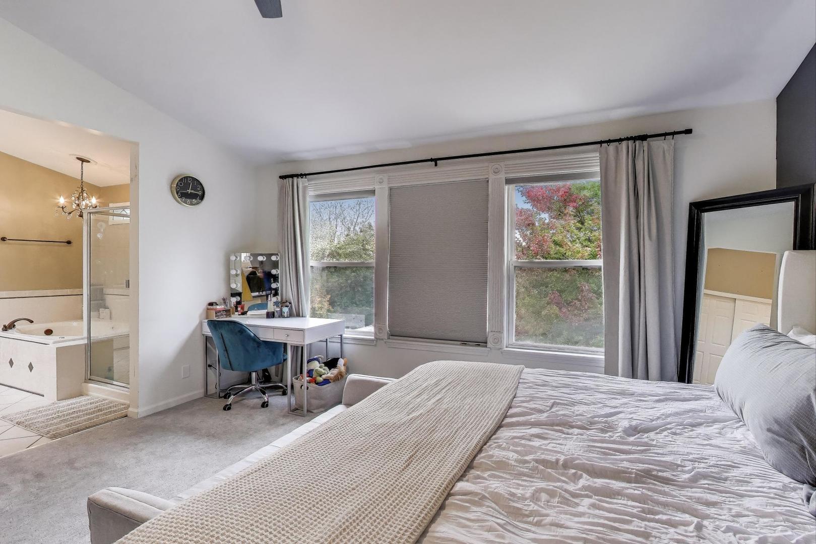 1010 Evergreen Street Mundelein, IL 60060 - Photo 16 of 28 a bed room with a bed and a table