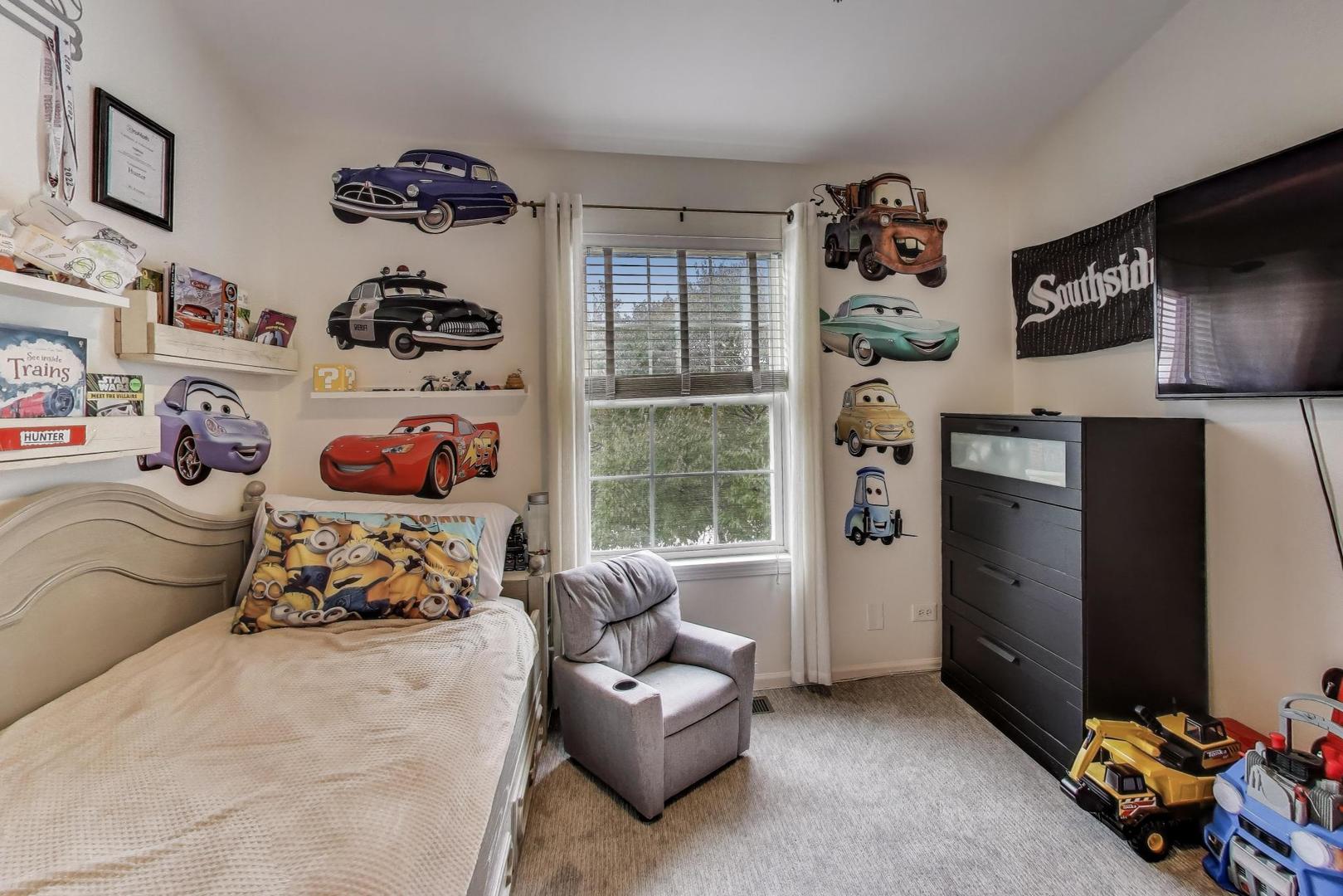 1010 Evergreen Street Mundelein, IL 60060 - Photo 21 of 28 a bedroom with a bed and a window